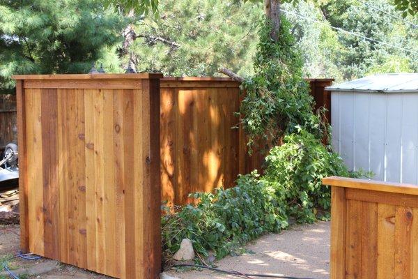 Custom built and stained garden fence.