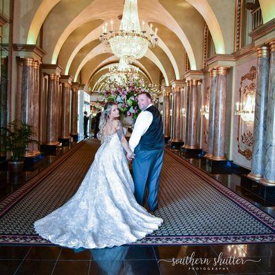 Couple in our gorgeous lobby. Photo by Southern Shutter