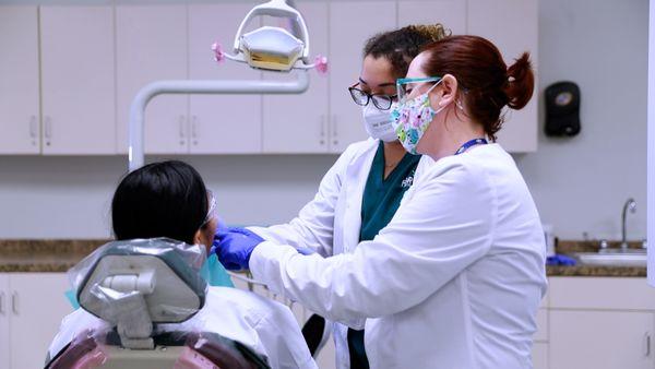 Dental Assisting student practicing on a patient