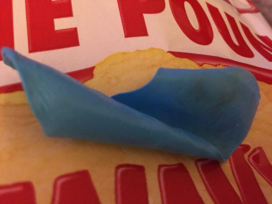 I found this piece of dirty, blue rubber in my bag of Conn's Chips, upon closer look, I realized it was the finger from a rubber glove.