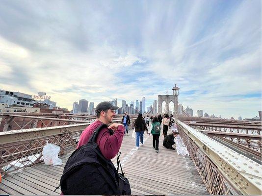 Our lead historian, Stefan, walking across the Brooklyn Bridge on a Private City tour!