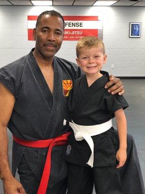 Hanshi Thomas Felder and his student after earning his first stripe!  I love how Hanshi takes individual time with students!