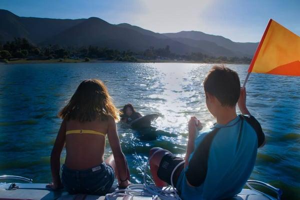 Kids Knee boarding on the Lake