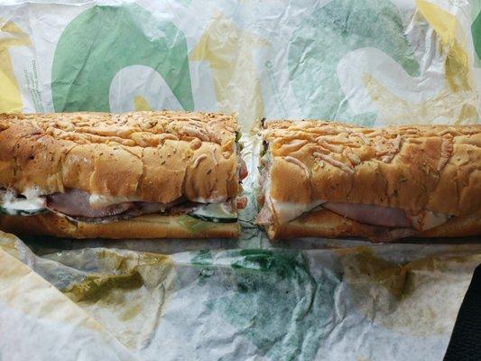 Toasted Subway Club on Italian Herbs and Cheese Bread Footlong.