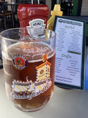 Paulaner & Beer list on an outside table.