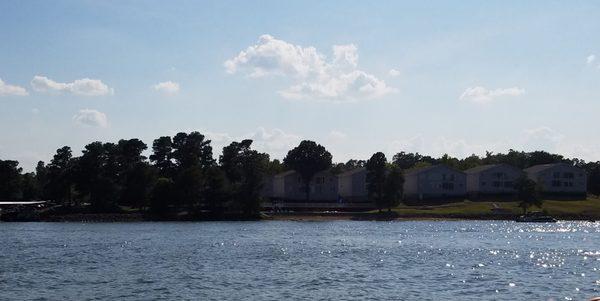 View of the Dens Condominiums from a pontoon boat on the lake.