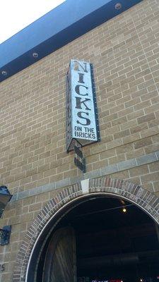 Look for the sign Nick's on the bricks