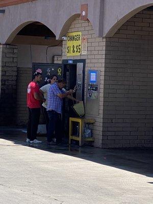 Employees ( on right) and customers (on left) not wearing masks.