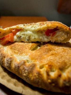 Make your own calzone with chicken and tomatoes.