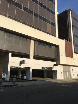 The entrance to the parking lot, from Colby Ave.