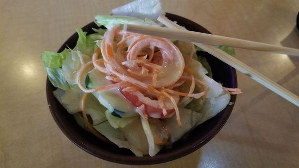 Salad: A simple mix of lettuce, cucumber and tomato, served with a miso-based dressing.