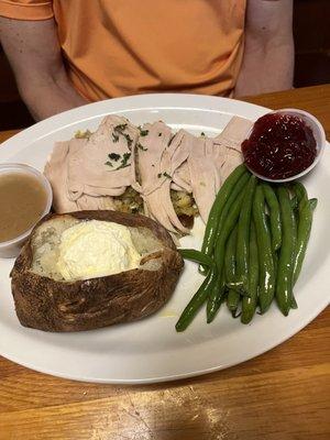 Turkey dinner with baked potato and green beans