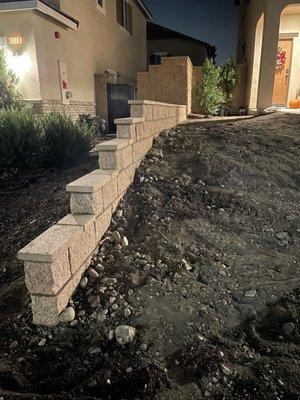 29' cinder block wall, footing, rebar, cement fill, tops, match existing wall.