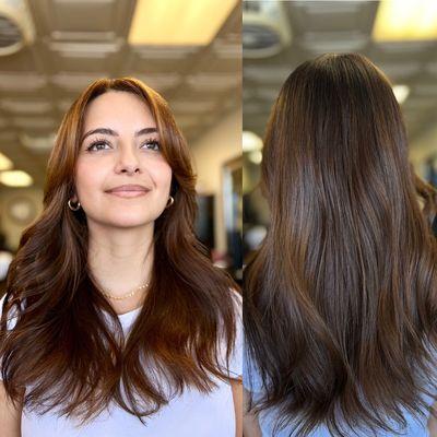 Caramel brunette balayage with long layer and curtain bang haircut.