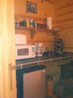 Kitchenette with fresh ground coffee, tea, and water    Microwave fridge toaster and coffee pot