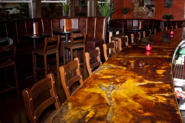 32' long, cast-in-place bar top, acid stained, with split face rock edges