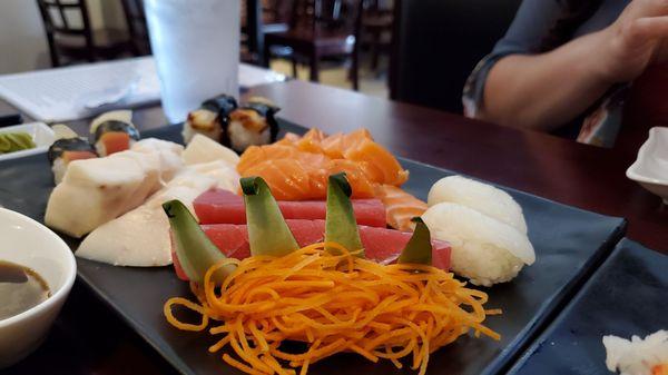 (From far left) Red clam and eel Nigiri, white tuna salmon sashimi, tuna sashimi and squid nigiri