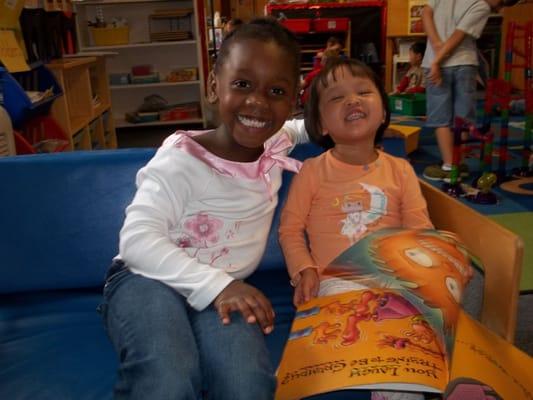 Exploring books together in our cozy reading corner!