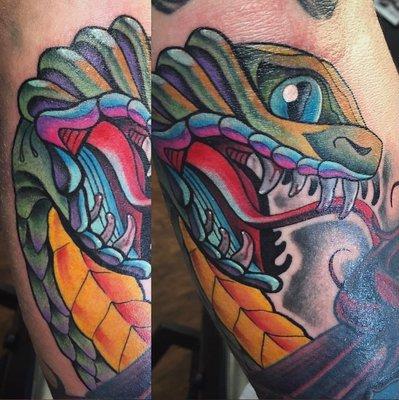 Illustrative snake head tattoo