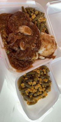 Pork chop & Gravy with rice , mashed potatoes, and double veggies ! So yummy