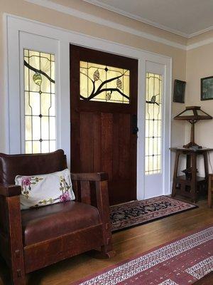 custom entryway design featuring branches + pine cones.