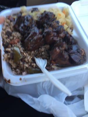 Brown stew chicken with rice and peas and cabbage