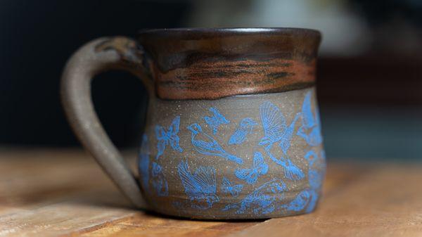 Custom ceramic bird mug handmade on the pottery wheel.