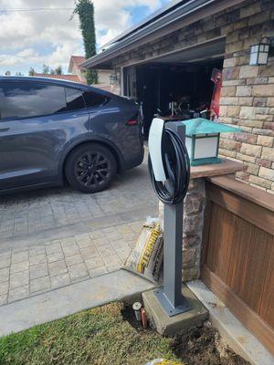 Ev charger installation using a pedestal and running the circuit underground.