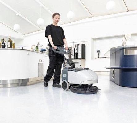 Using a micro scrubber to apply a neutral floor cleaner, scrub and vacuum in one pass.