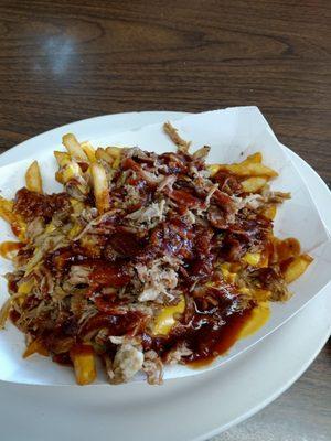 This was called stadium price it was french fries pulled pork barbecue sauce and an overload nacho cheese