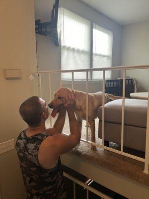 My husband and partner petting Hunter our pet client.