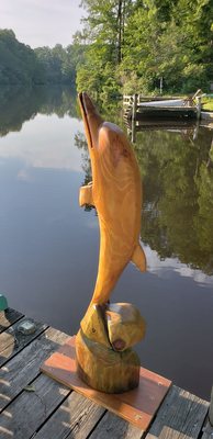 A dolfin sculpture we sanded , stained with clothing dye and finished with outside varnish for our daughter's dock.