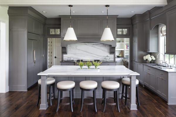 Wow! This elegant kitchen on Lake Minnetonka features Lincoln Gold Vein Marble on the island. The perimeters counter tops are a new product