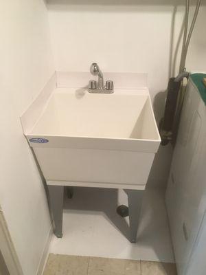 Recently replaced old utility sink with new sink.