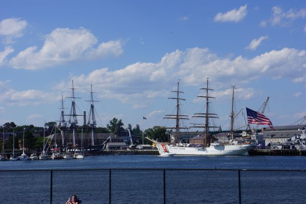 View (from pool) of U.S.S. Constitution and visiting Coast Guard Ship.