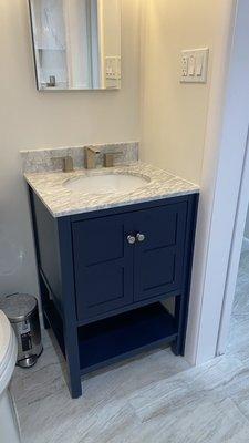 All wood vanity, marble top.