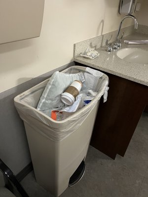 Room conditions completely full trash can already inside the room