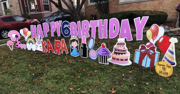 Happy birthday signs on the lawn