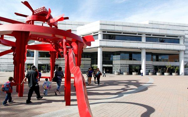 Joel D. Valdez Main Library with sculpture "Sonora" on Jacome Plaza.