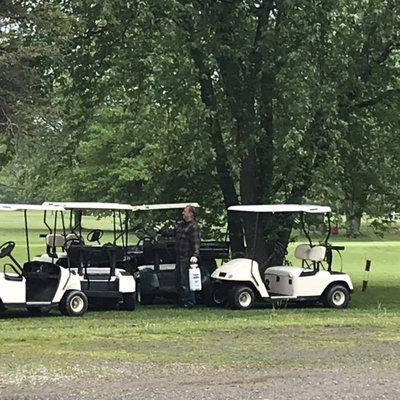 Owner is Sanitizing the golf carts