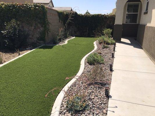 American made Greenridge installed in the Jurupa Valley with curbing and Arizona River rock.