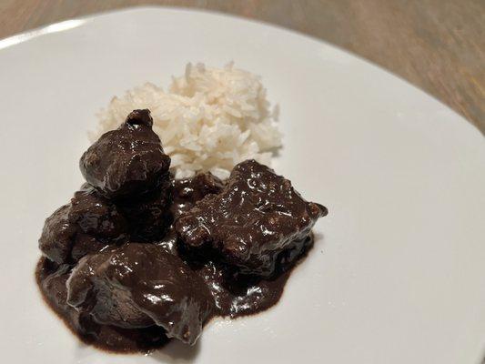 Dinuguan (Pork offal stewed in pig blood). Boldly flavored with vinegar, various spices, and brown sugar. The meat is inconsistent though.