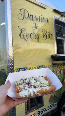 taquitos with the food truck behind it