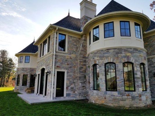 Natural stone veneer ans stucco house done by us in Brookville NY