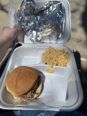 Pulled pork sandwich with macaroni and cheese.  Plain Lays on the side makes a meal!