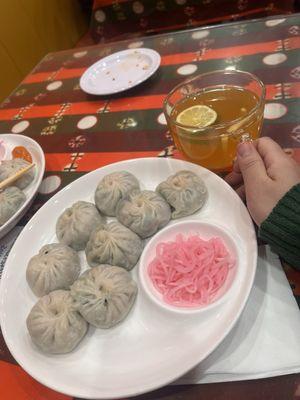 Chive Veg momo with side of radish salad that comes with the order .