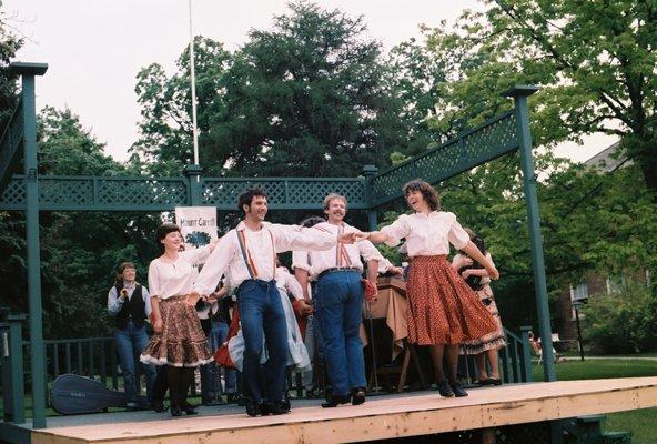 The Kickapoo Cloggers are performing a maneuver called dips and dives.  The hammered dulcimer is just under Stephanie's right elbow.