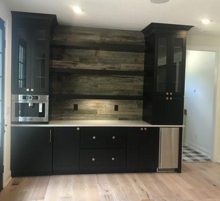 Cool Black Bar with coffee system, beverage center, and ice maker.
 Caruso Cabinets