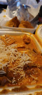 Lunch box with chicken Tikka, a curry lamb, rice and chapati. And a side order of potato samosas. Yummm.