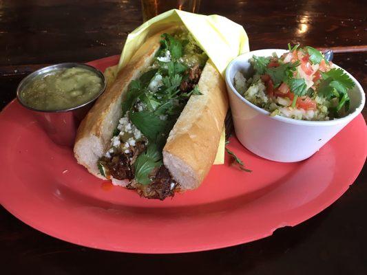 Carnitas torta and a side of rice. Also for extra shazam I added the avocado salsa.